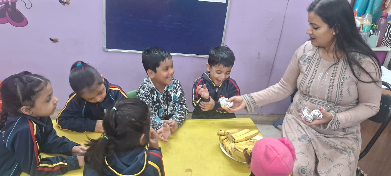 Children smiling while receiving food